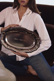 Person holding a silver tray with 'Made With Love' engraving